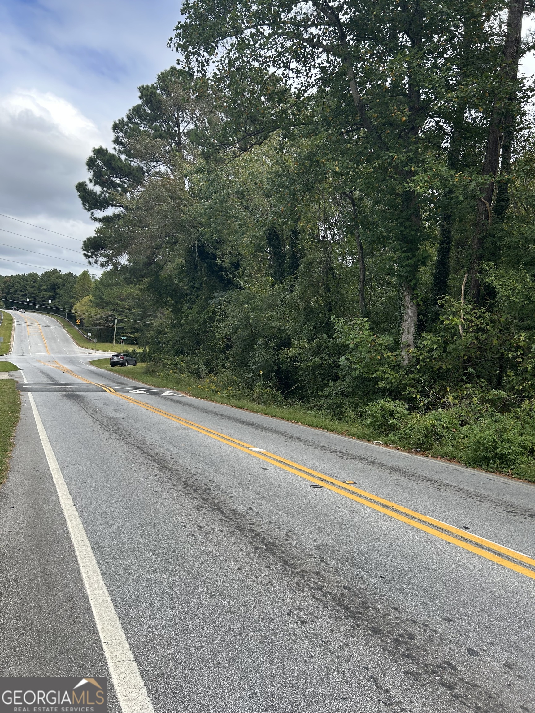 0 Anderson Terrace Snellville, GA 30039 - Photo 11 of 21 a view of a road with a field of the house