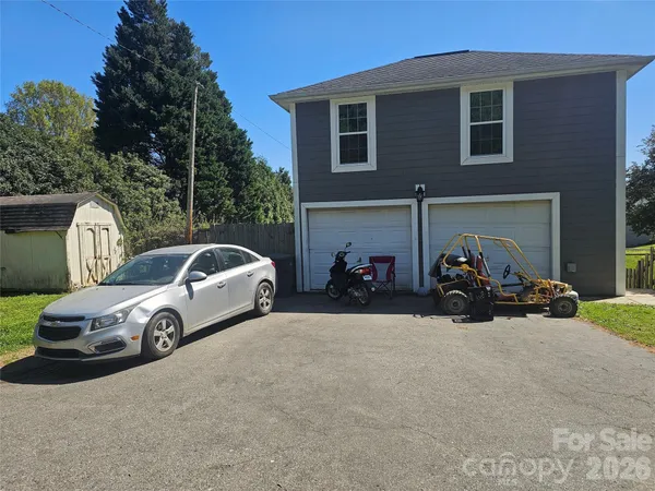 a front view of a house with parking space