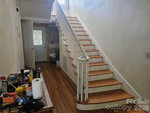 a view of entryway with wooden floor