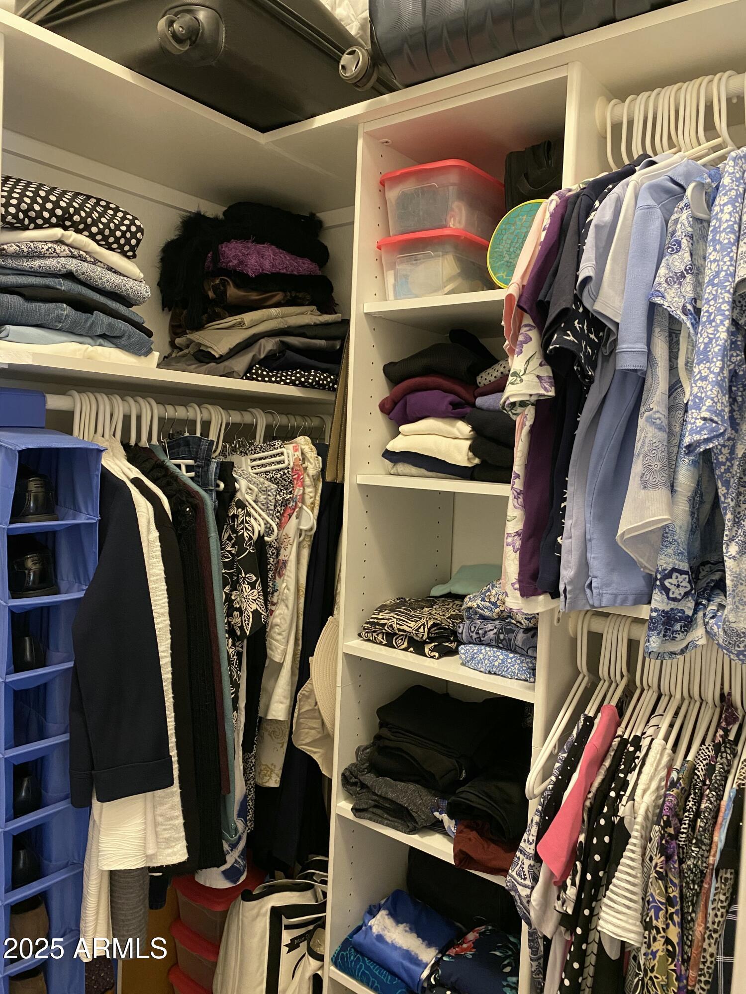 4777 South Fulton Ranch Boulevard, Unit 1074 Chandler, AZ 85248 - Photo 13 of 28 a view of walk in closet with clothes and shoes