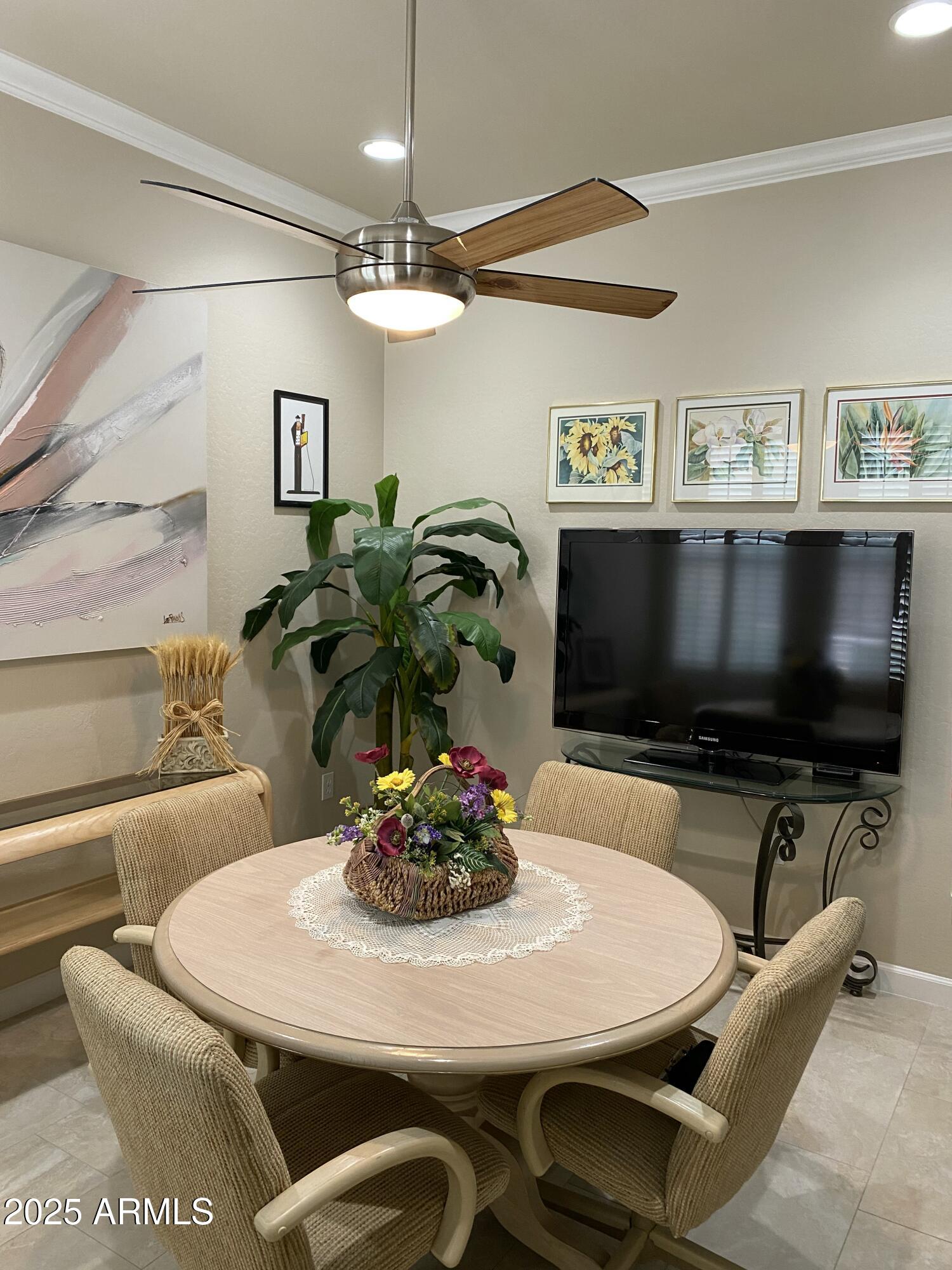 4777 South Fulton Ranch Boulevard, Unit 1074 Chandler, AZ 85248 - Photo 17 of 28 a dining room with furniture and a flat screen tv