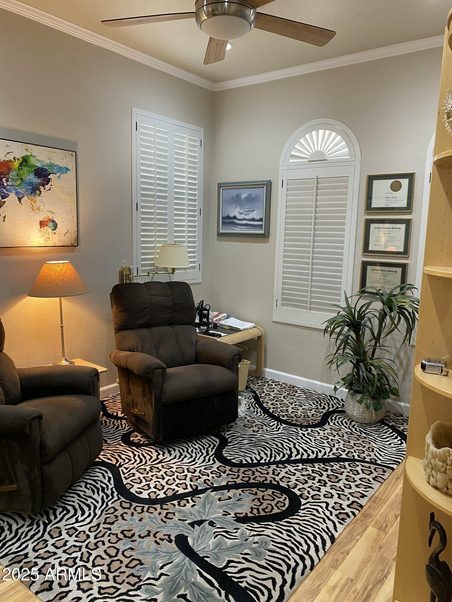 4777 South Fulton Ranch Boulevard, Unit 1074 Chandler, AZ 85248 - Photo 19 of 28 a living room with furniture and a chandelier