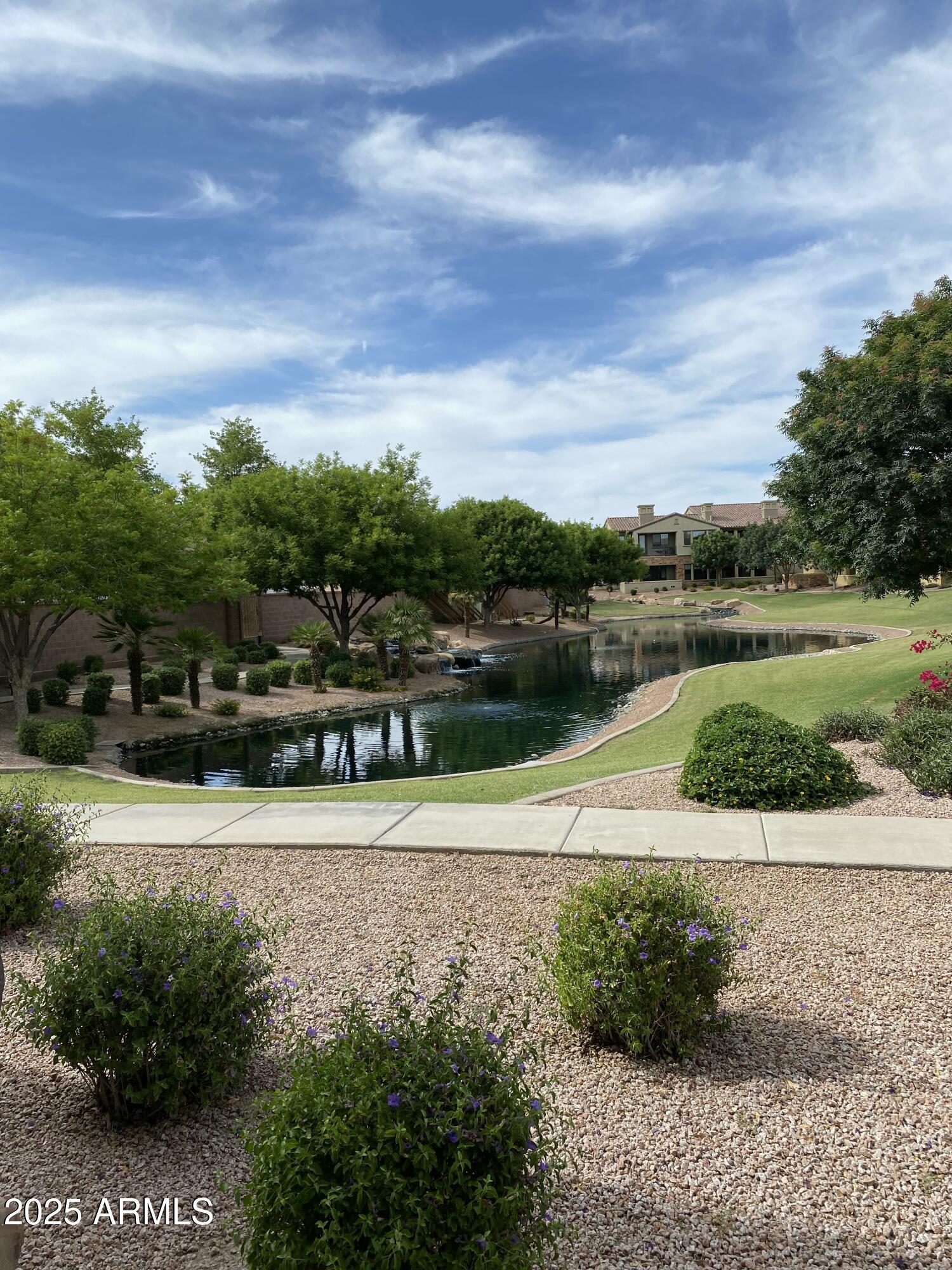 4777 South Fulton Ranch Boulevard, Unit 1074 Chandler, AZ 85248 - Photo 23 of 28 a view of a lake with houses