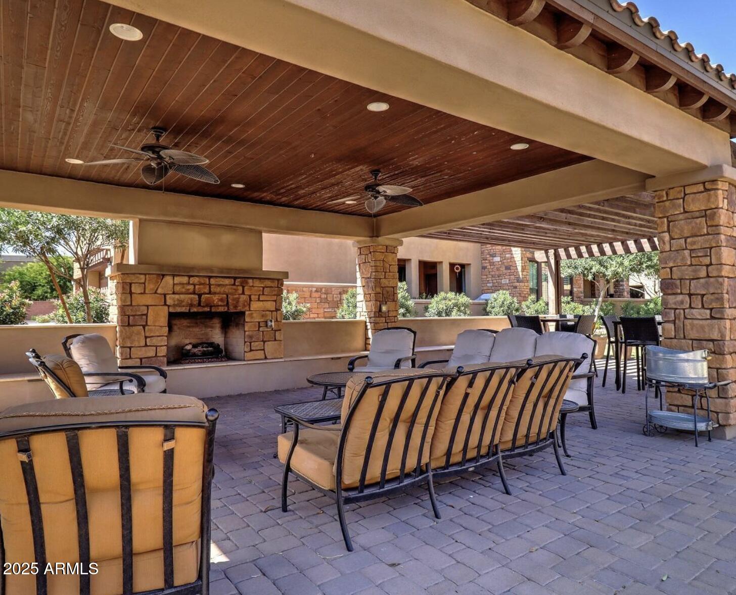 4777 South Fulton Ranch Boulevard, Unit 1074 Chandler, AZ 85248 - Photo 25 of 28 a living room with furniture a fireplace and a table