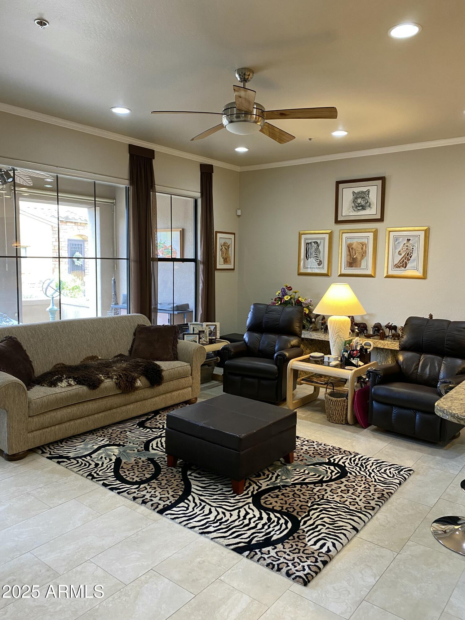 4777 South Fulton Ranch Boulevard, Unit 1074 Chandler, AZ 85248 - Photo 4 of 28 a living room with furniture a rug and a window