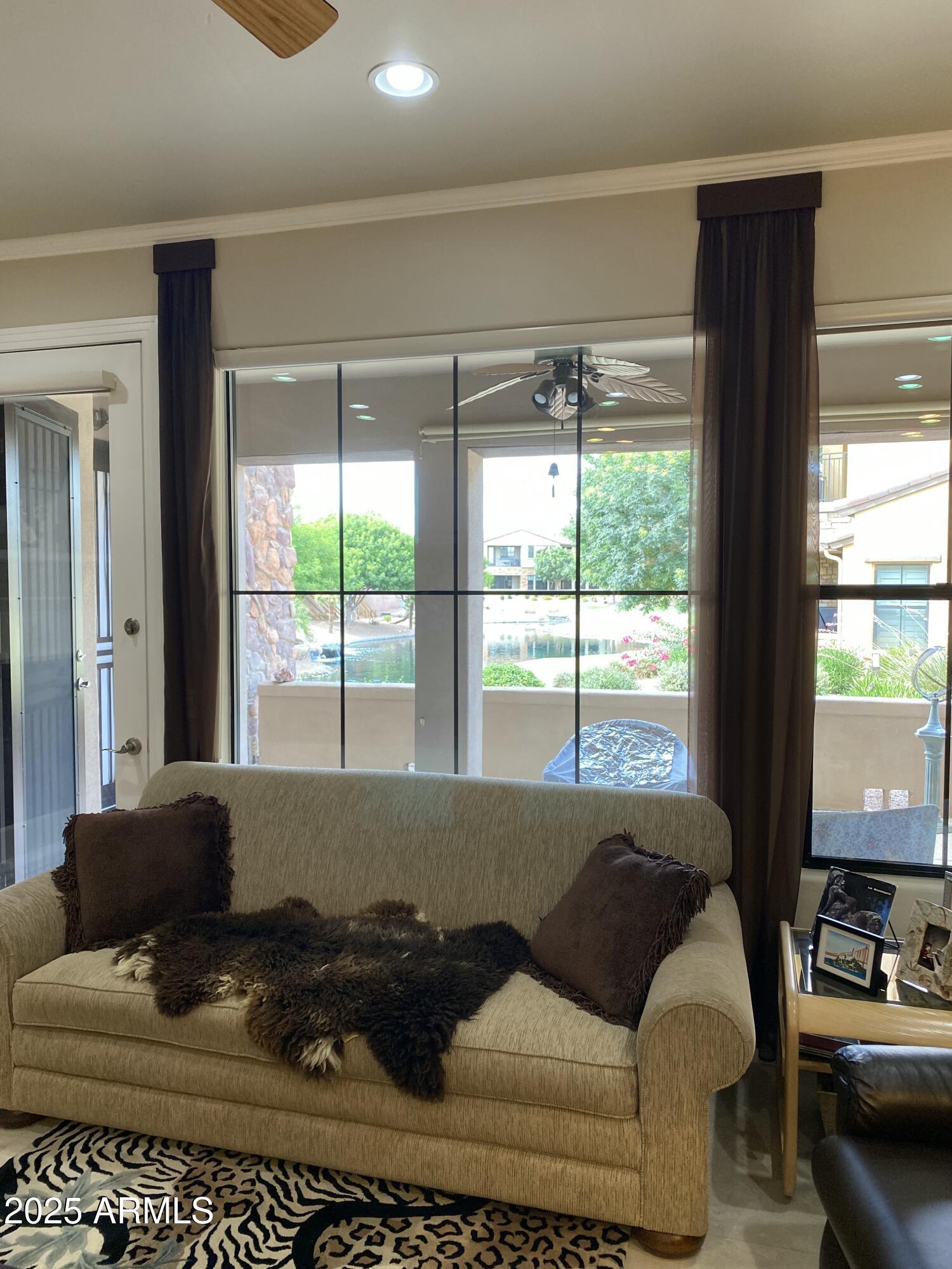 4777 South Fulton Ranch Boulevard, Unit 1074 Chandler, AZ 85248 - Photo 5 of 28 a living room with furniture and a large window