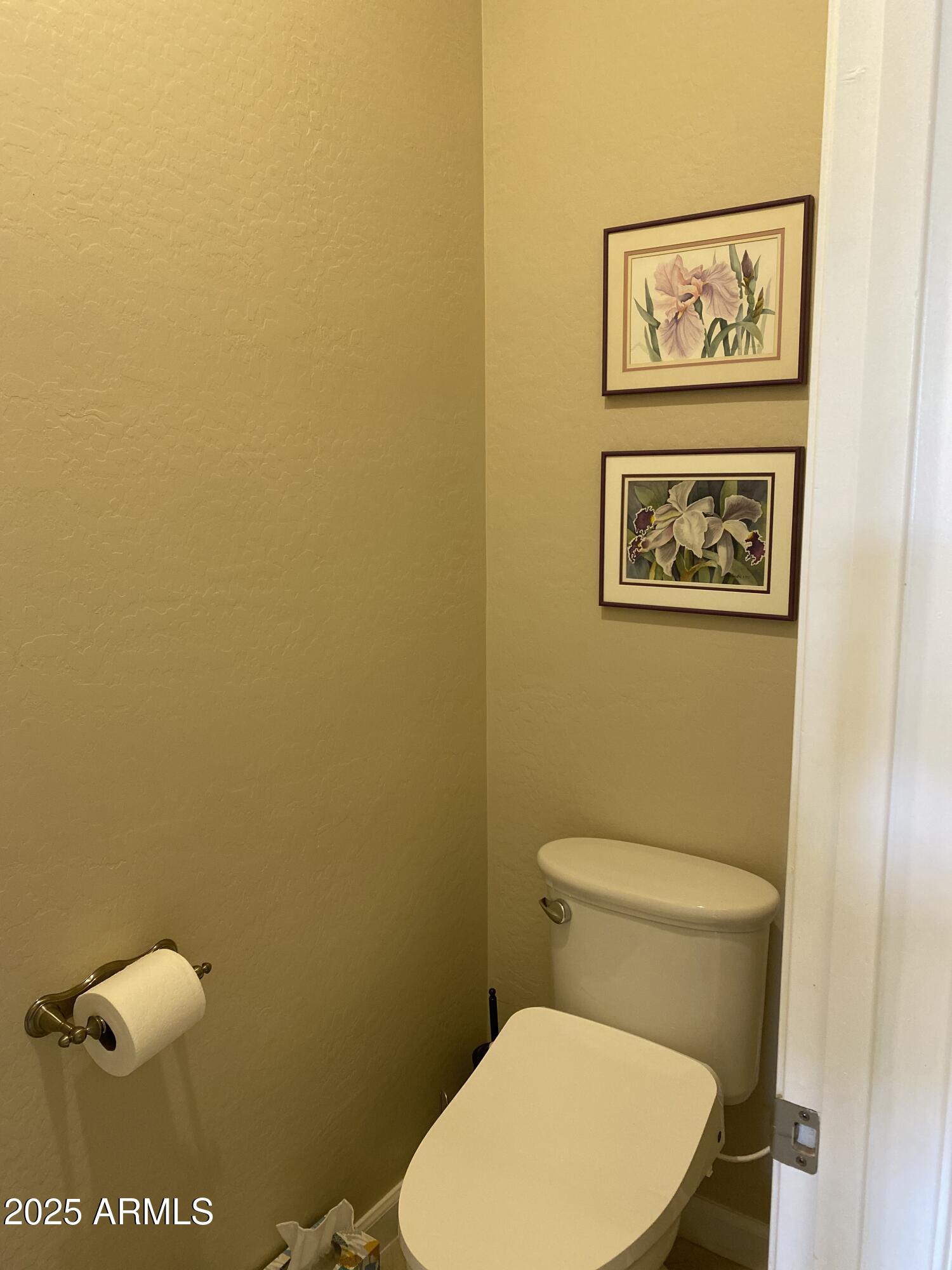 4777 South Fulton Ranch Boulevard, Unit 1074 Chandler, AZ 85248 - Photo 9 of 28 a white toilet sitting next to a sink