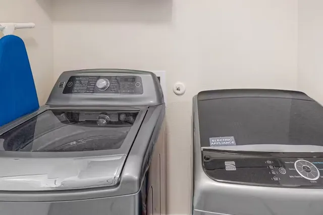a utility room with washer and dryer