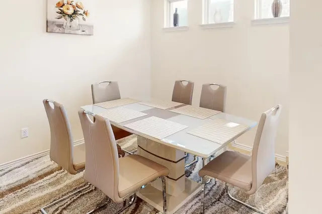 a view of a dining room with furniture