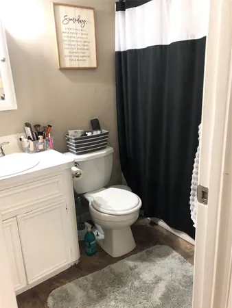 a bathroom with a sink and a toilet