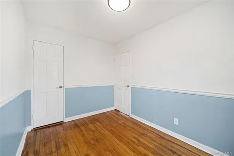 a view of a living room with wooden floor