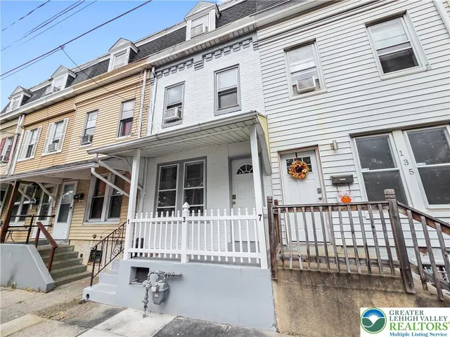 a front view of a house with a porch
