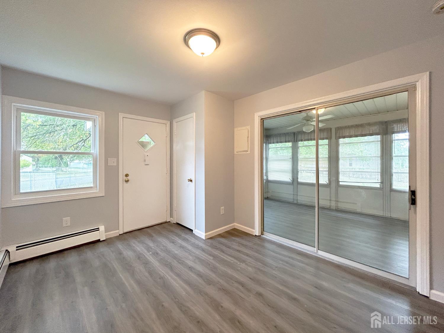3 Stiles Road Edison, NJ 08817 - Photo 19 of 21 an empty room with wooden floor and windows