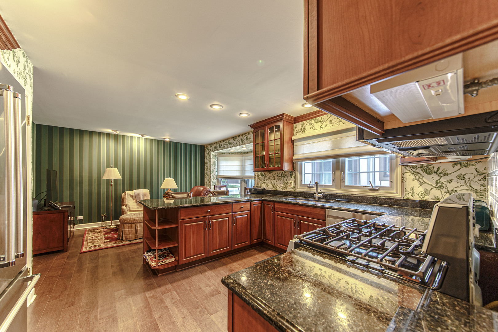 1109 Oakview Drive Wheaton, IL 60187 - Photo 5 of 23 a kitchen with stainless steel appliances granite countertop a stove a sink dishwasher and cabinets next to a window