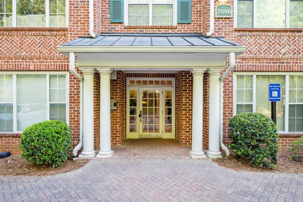 2103 Stratford Commons Decatur, GA 30033 - Photo 19 of 24 a front view of a house with a yard