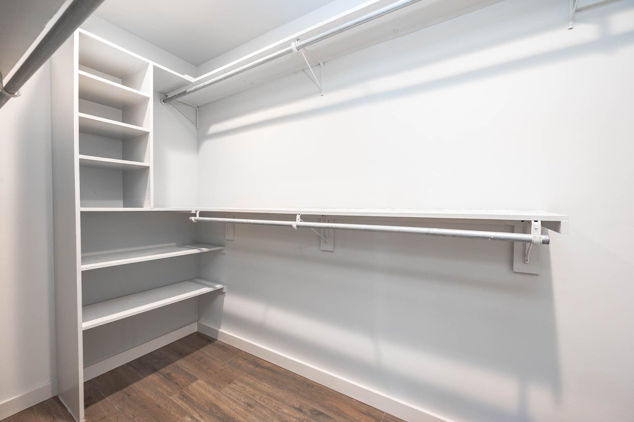 6030 Warm Springs Road Houston, TX 77035 - Photo 30 of 40 Walk-in primary closet with built-in shelving for accessories & shoes.