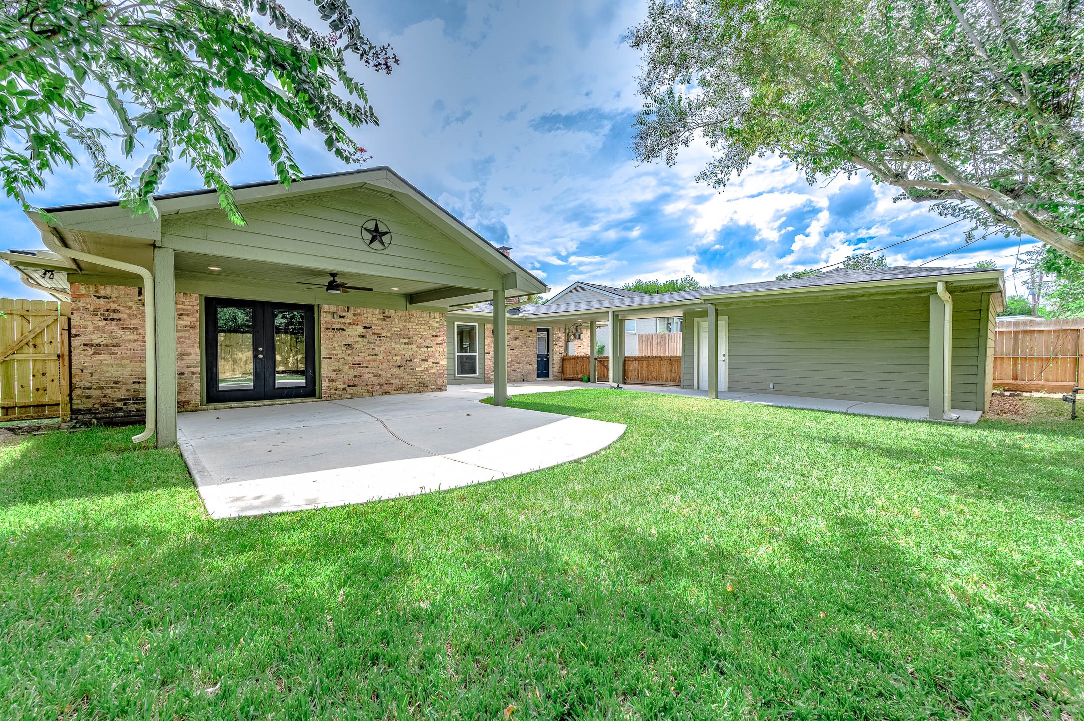 6030 Warm Springs Road Houston, TX 77035 - Photo 37 of 40 a front view of a house with a yard and garage