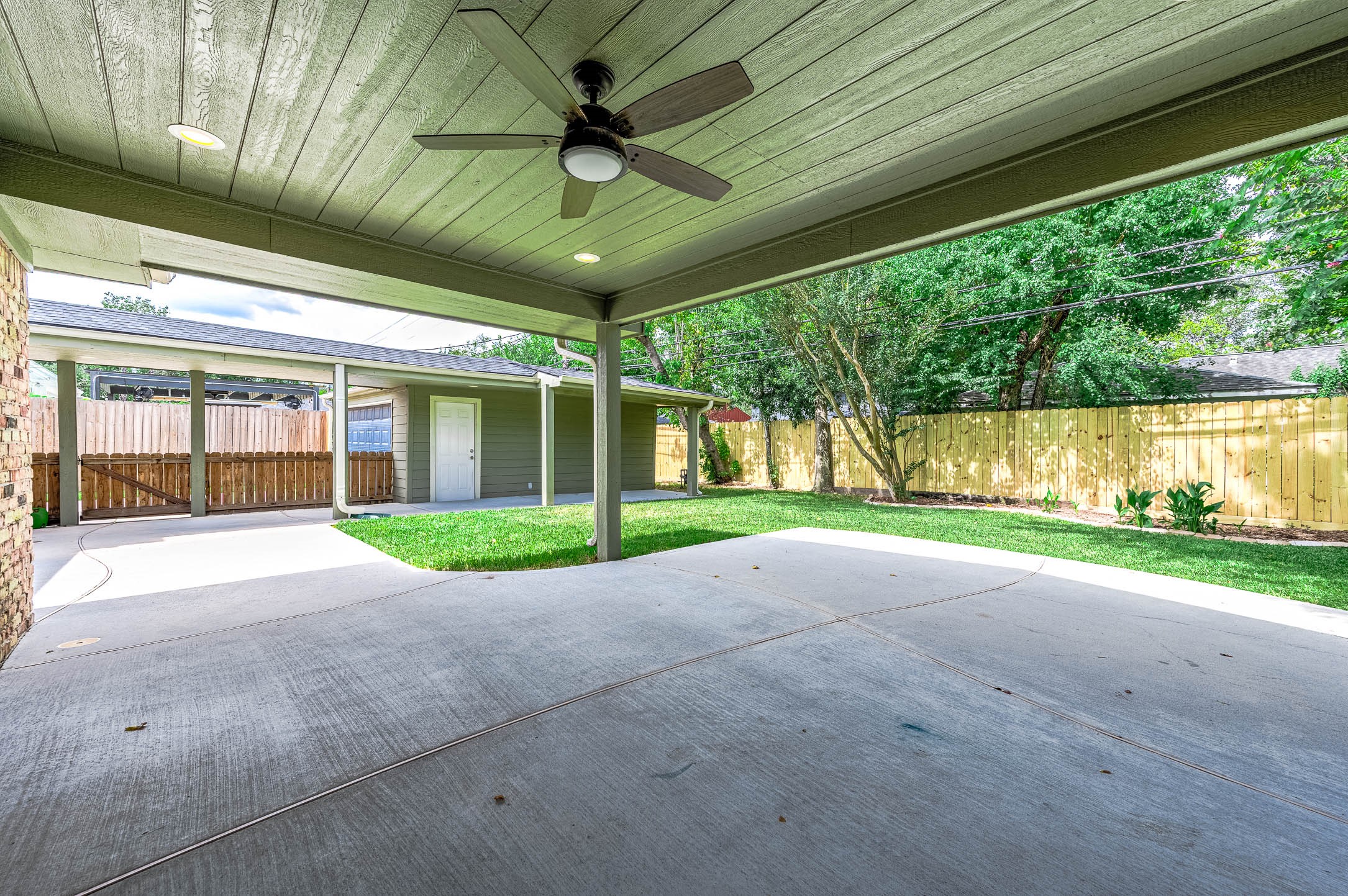 6030 Warm Springs Road Houston, TX 77035 - Photo 40 of 40 Large covered deck/patio has a fan & outdoor speakers to enhance your family or friend gatherings.