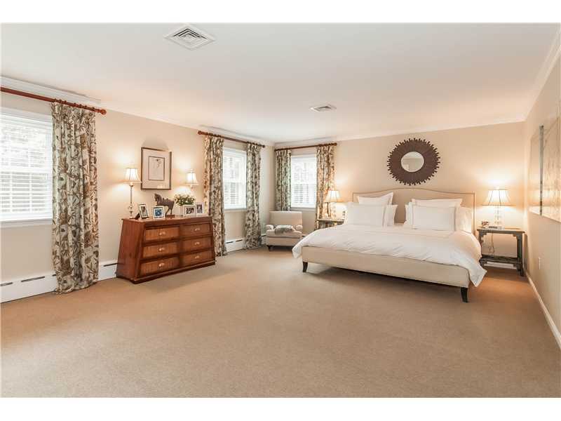 145 Marvin Ridge Road New Canaan, CT 06840 - Photo 12 of 24 a bedroom with bed and a large window