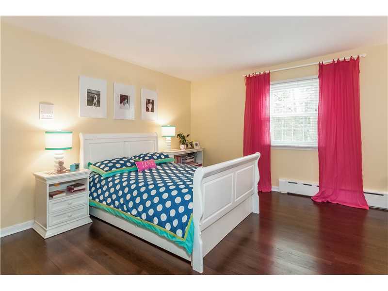145 Marvin Ridge Road New Canaan, CT 06840 - Photo 14 of 24 a bed room with a bed and a window