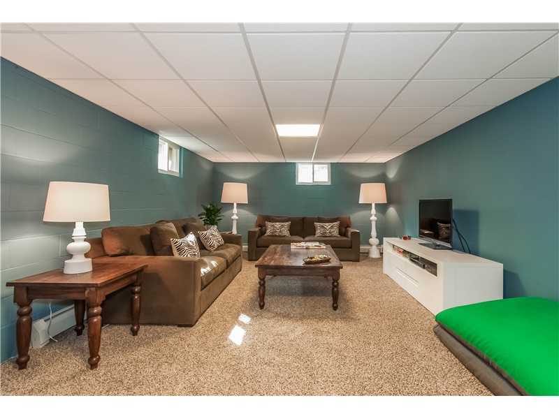 145 Marvin Ridge Road New Canaan, CT 06840 - Photo 18 of 24 a living room with furniture and a flat screen tv