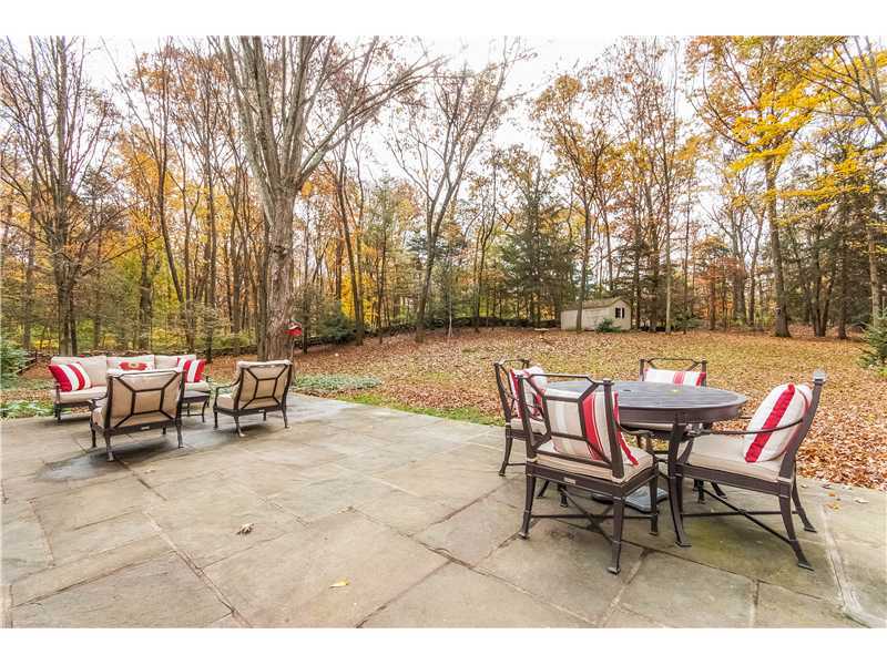 145 Marvin Ridge Road New Canaan, CT 06840 - Photo 19 of 24 a backyard of a house with table and chairs