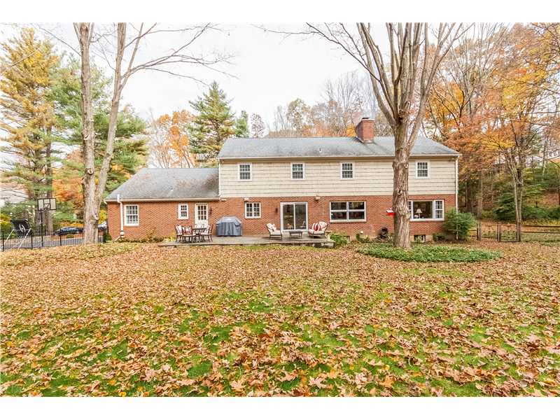 145 Marvin Ridge Road New Canaan, CT 06840 - Photo 21 of 24 front view of a house with a yard