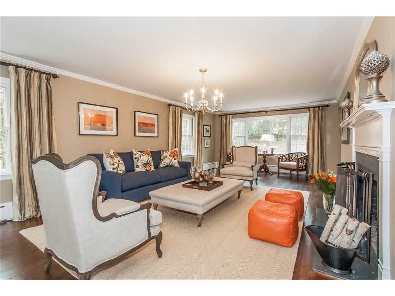 145 Marvin Ridge Road New Canaan, CT 06840 - Photo 4 of 24 a living room with furniture a rug and a chandelier