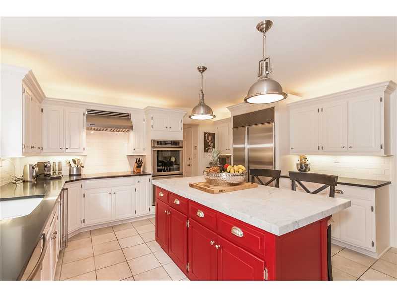 145 Marvin Ridge Road New Canaan, CT 06840 - Photo 8 of 24 a kitchen with sink stove and cabinets
