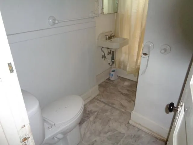a bathroom with a sink and toilet