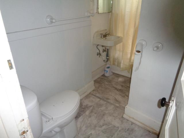 735 North Court Street Rockford, IL 61103 - Photo 14 of 14 a bathroom with a sink and toilet