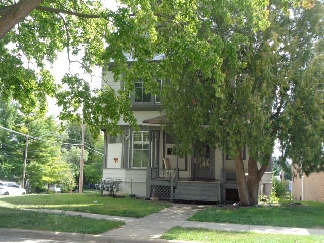 735 North Court Street Rockford, IL 61103 - Photo 2 of 14 front view of a house with a tree