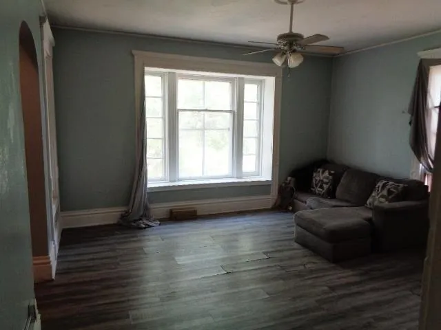 a living room with furniture and a window