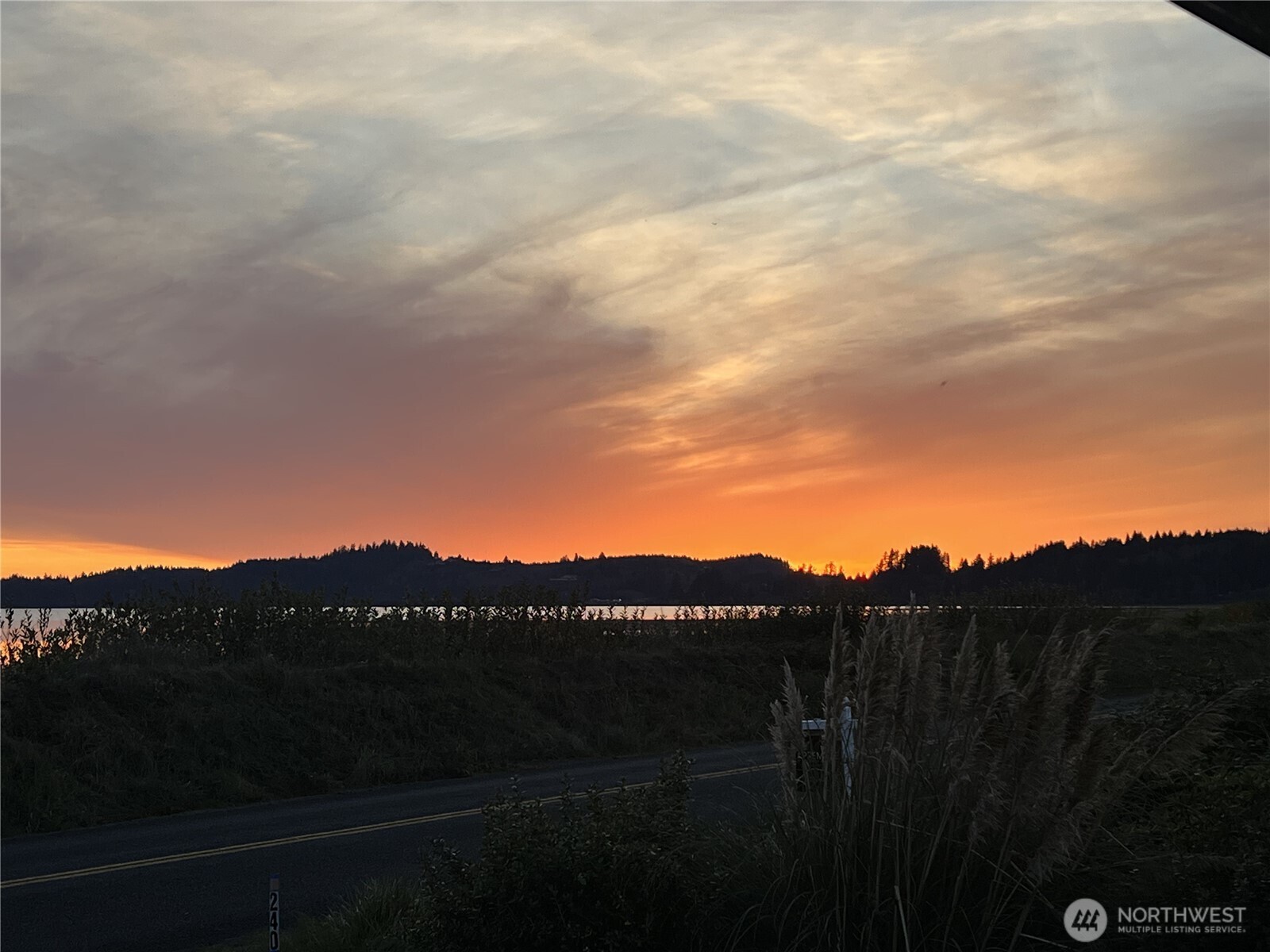 240 Stringtown Road Ilwaco, WA 98624 - Photo 30 of 39 a view of a city with sunset view