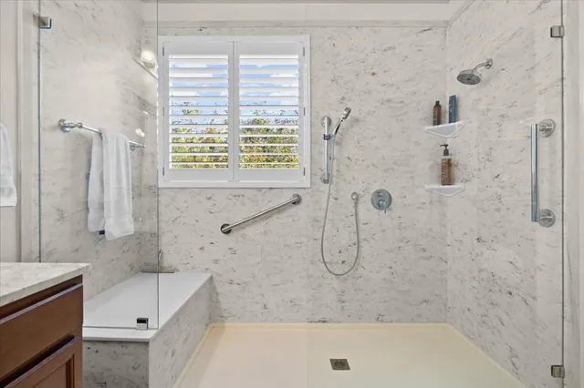 a bathroom with a bathtub and a shower