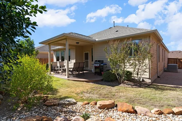 a view of a chairs and table in the patio
