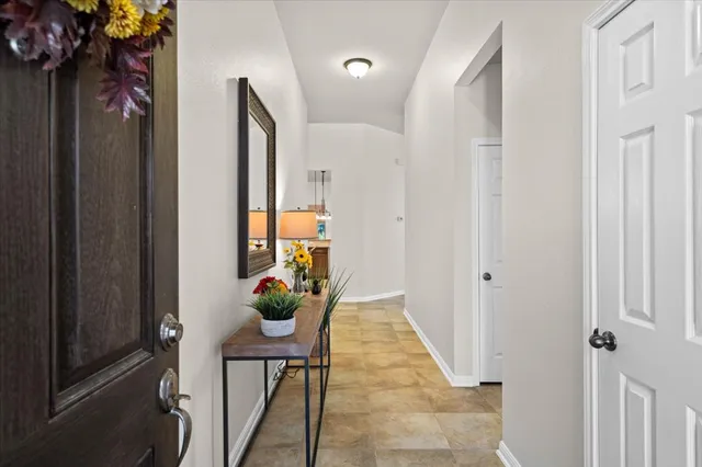 a view of a hallway and interior of the house