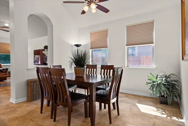 a dining room with furniture and window