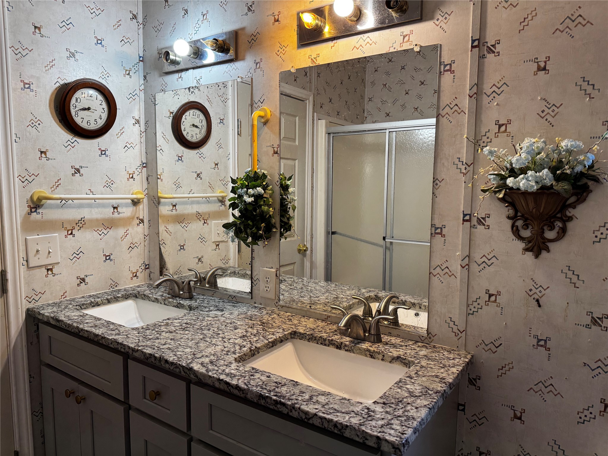 15930 Boss Gaston Road Sugar Land, TX 77498 - Photo 16 of 20 a bathroom with a sink and a mirror