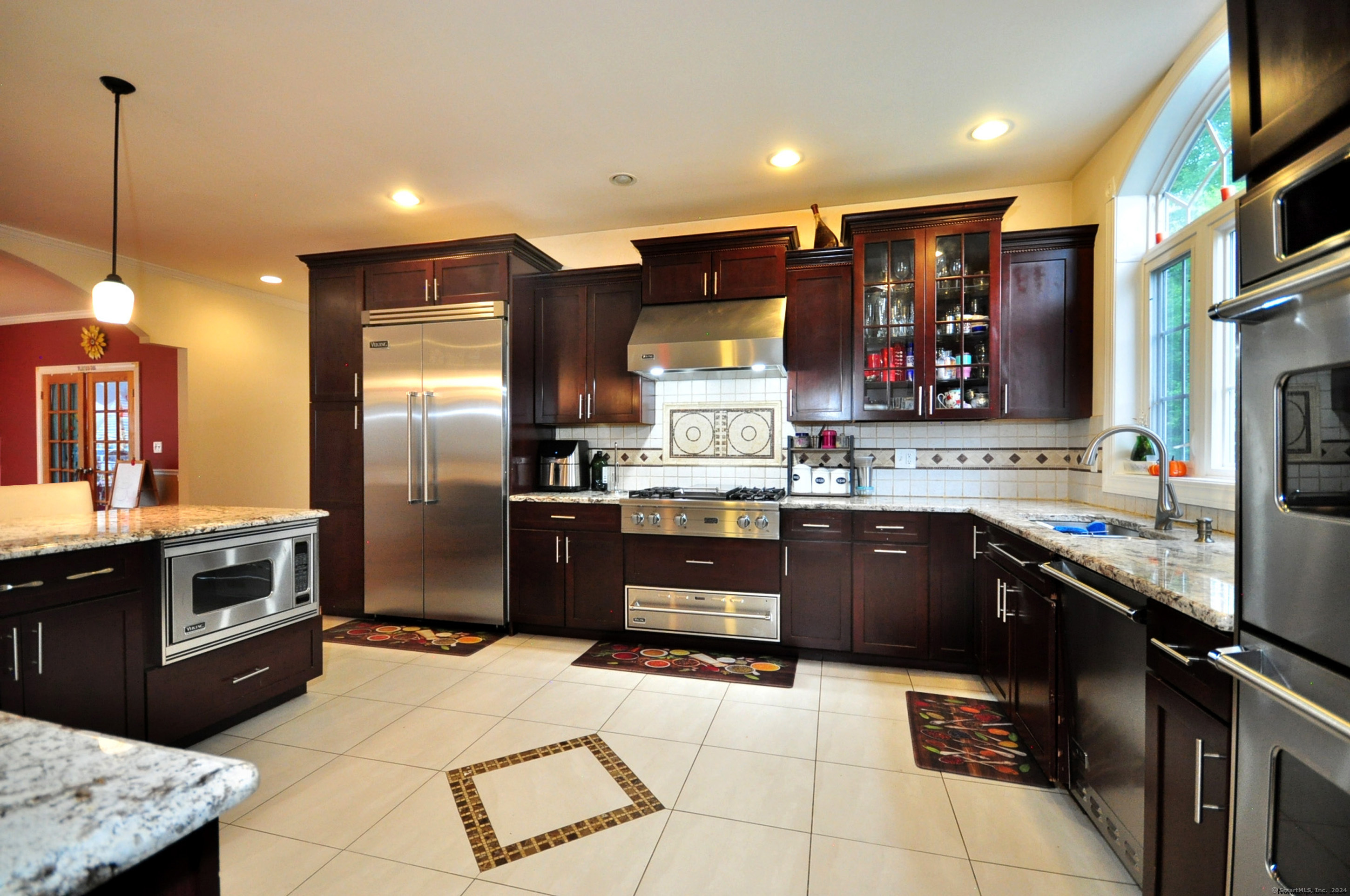 3 Maplecrest Lane Hamden, CT 06514 - Photo 12 of 40 a kitchen with stainless steel appliances granite countertop a stove a sink a refrigerator and a oven