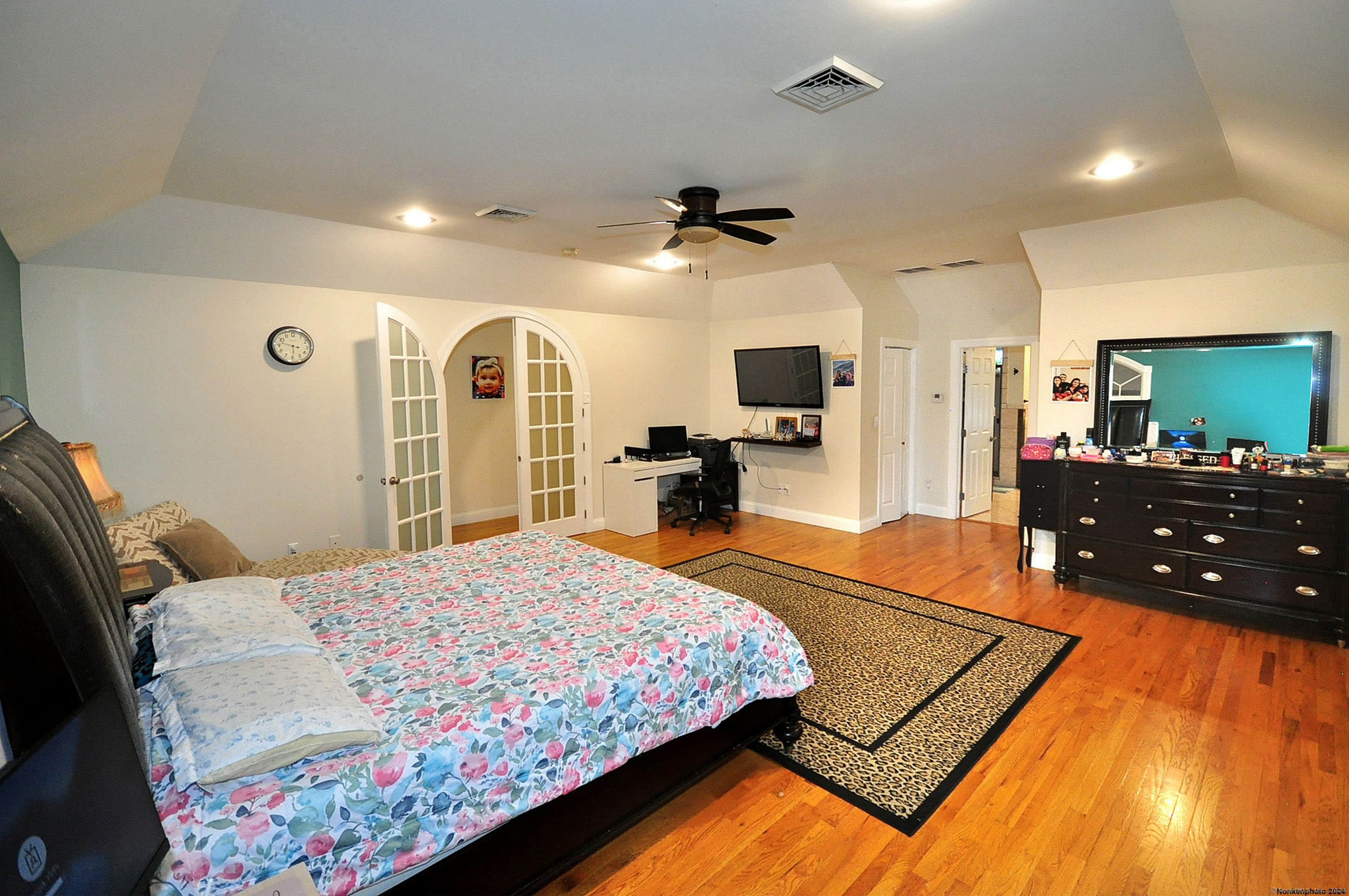 3 Maplecrest Lane Hamden, CT 06514 - Photo 28 of 40 a bedroom with a bed dresser and a flat screen tv