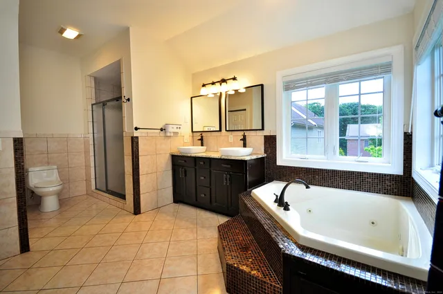 a bathroom with a bathtub sink and toilet