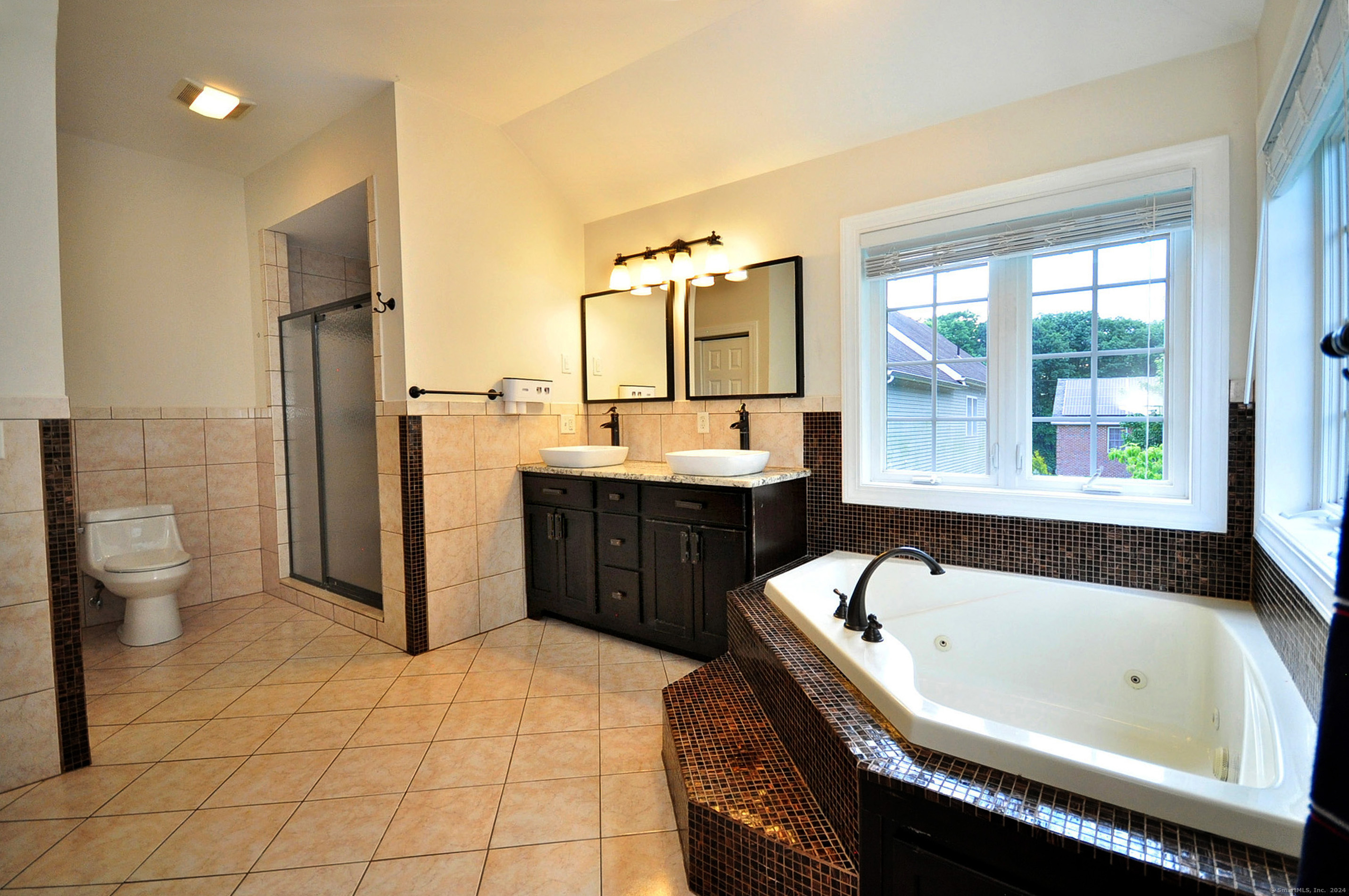 3 Maplecrest Lane Hamden, CT 06514 - Photo 29 of 40 a bathroom with a bathtub sink and toilet