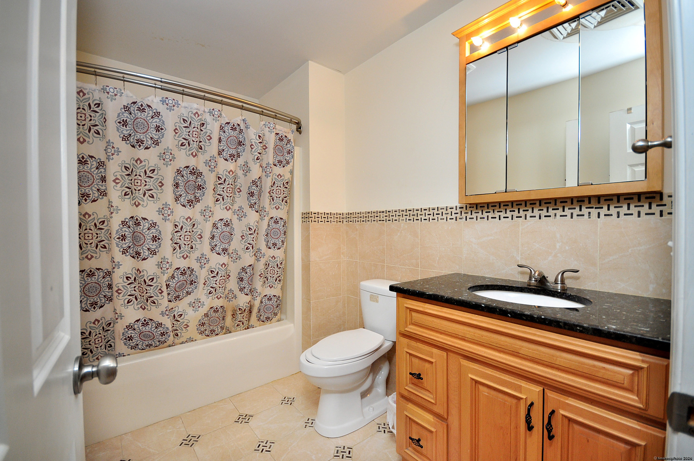 3 Maplecrest Lane Hamden, CT 06514 - Photo 34 of 40 a bathroom with a granite countertop sink a toilet and a shower