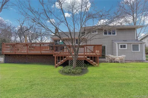 a view of a house with a yard porch and sitting area
