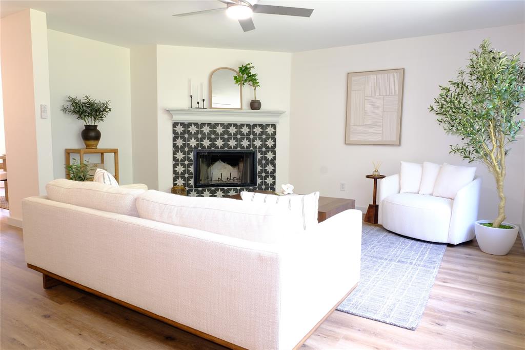 3437 Caprock Ranch Road Fort Worth, TX 76262 - Photo 5 of 27 a living room with furniture and a fireplace