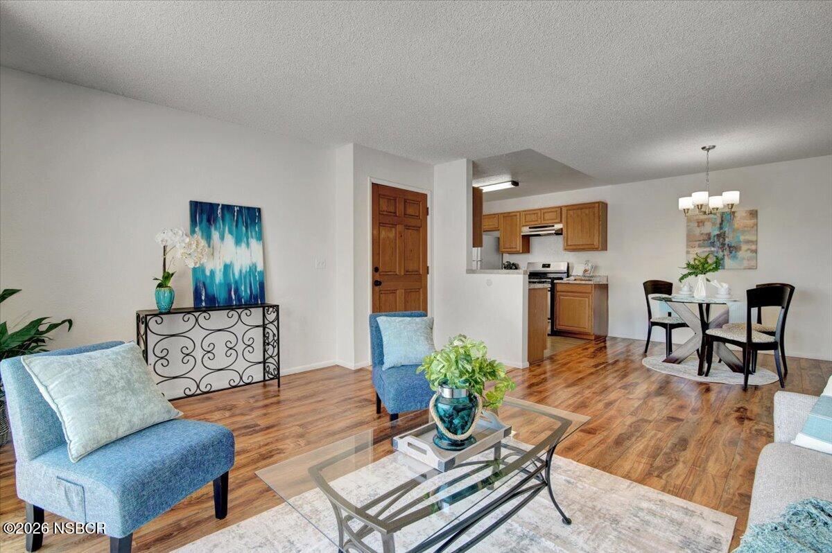 3400 Santa Maria Way, Unit 207B Santa Maria, CA 93455 - Photo 14 of 50 a living room with furniture and wooden floor