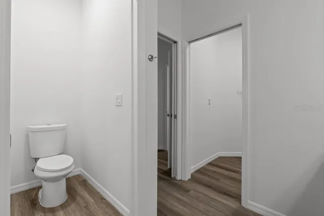 a bathroom view of a toilet and a sink