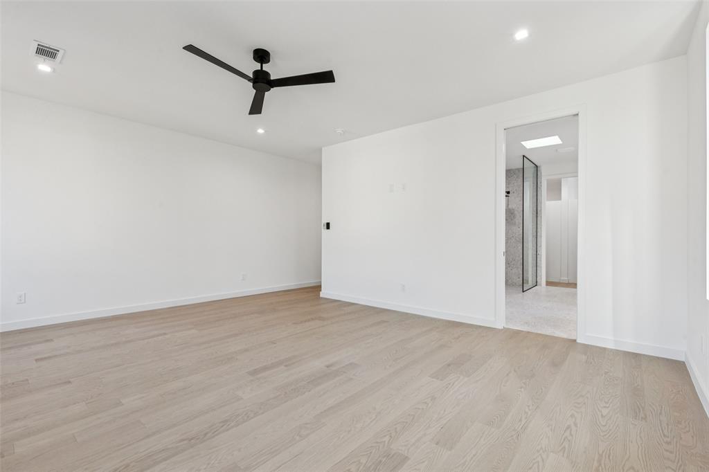 5635 Matalee Avenue Dallas, TX 75206 - Photo 19 of 27 a view of a room with wooden floor and a ceiling fan