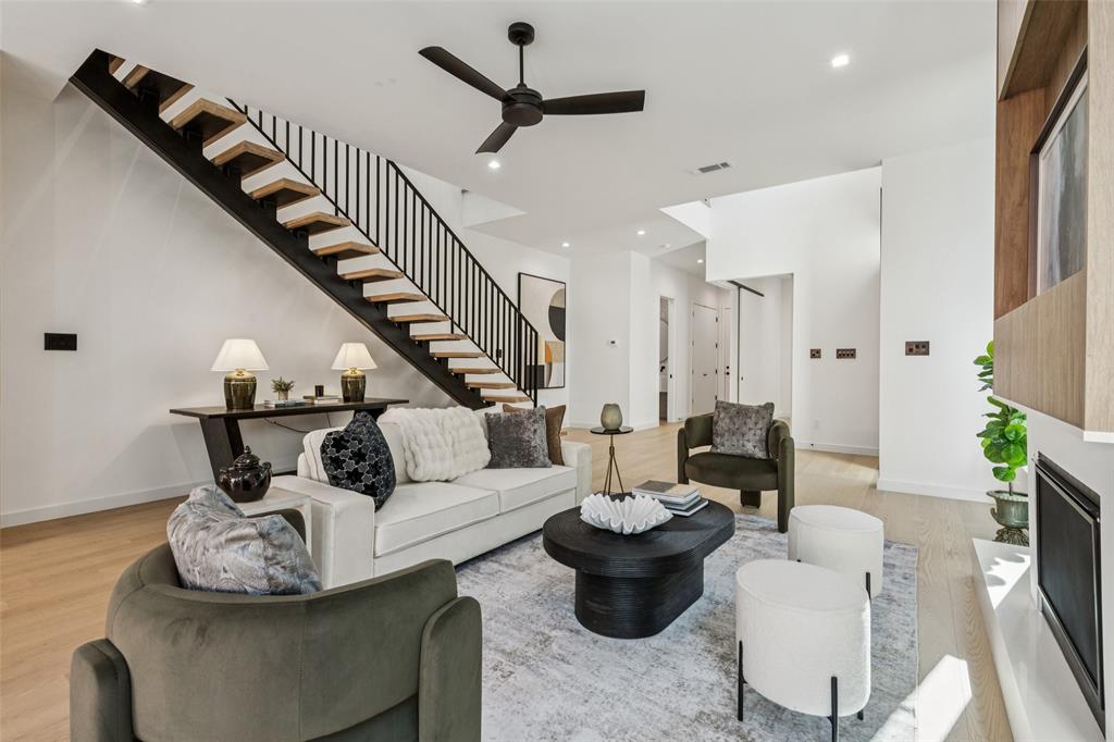 5635 Matalee Avenue Dallas, TX 75206 - Photo 6 of 27 a living room with furniture and a chandelier